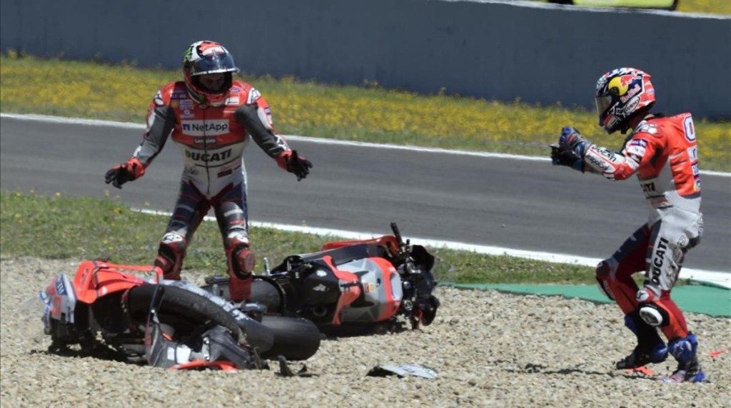 Ducati Team s Italian rider Andrea Dovizioso R and Ducati Team s Spanish rider Jorge Lorenzo stand next to their bikes after falling down during the MotoGP race of the Spanish Grand Prix at the Jerez Angel Nieto racetrack in Jerez de la Frontera on May 6 2018 AFP PHOTO JAVIER SORIANO